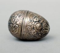 An 18th century silver nutmeg grater, possibly marked for London 1789 The embossed egg form body