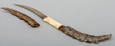 A 19th century Sudanese double bladed knife The central bone handle issuing twin etched curved