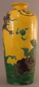 A Chinese pottery vase Tube lined and polychrome decorated with mythical beasts amongst stylised