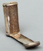 A 19th century unmarked silver nutmeg grater Of cylindrical form with a hinged lid and folding
