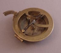 A 19th century brass cased pocket sextant Of typical construction, unsigned. 6.5 cms diameter.