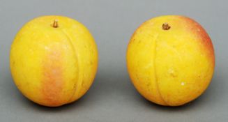 A pair of Italian carved marble faux peaches Each naturalistically modelled. 7 cms high. (2)