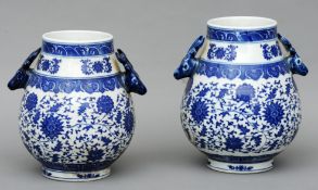 A pair of Chinese porcelain blue and white vases Of baluster form, decorated with lotus strapwork
