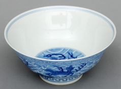 A Chinese blue and white porcelain bowl The interior centrally decorated with a dragon, the exterior