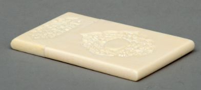 A Cantonese carved ivory card case Carved to either side with panels of figures with a vacant