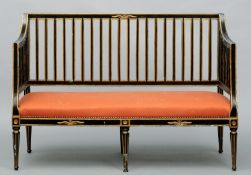 A Regency ebonised and parcel gilt settee The square section back and curved arms supported by