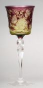 A Stevens & Williams of Stourbridge intaglio cut cameo wine glass Amethyst and yellow overlaid,