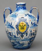 A Continental tin glazed twin handled bottle vase Decorated with a cartouche within and Italianate