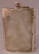 A late 20th century silver spirit flask, hallmarked for Birmingham, maker’s mark of SJR The hinged