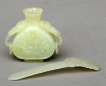 A Chinese celadon jade hair ornament and a small Chinese celadon jade vase With ring handles. The