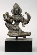 An early Indian bronze Hindu figure of Shiva, circa 14th century Modelled seated in typical form,