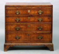 An 18th century walnut caddy top chest of drawers The feather banded moulded rectangular top above a