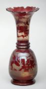 A 19th century Bohemian flashed ruby glass vase The flaring castellated neck rim above etched