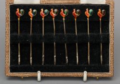 A set of eight enamel decorated silver cocktail sticks, hallmarked Birmingham 1951 Each finial