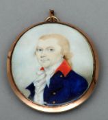 An English 18th century portrait miniature of a gentleman, wearing a navy blue coat The reverse
