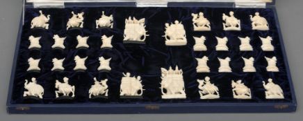 An Indian carved ivory chess set The pieces variously carved as figures and figures riding