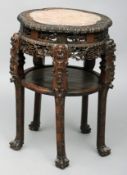 A late 19th/early 20th century Chinese hardwood centre table The marble inset lobed circular top