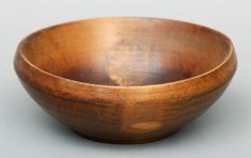 A late 18th/early 19th century turned sycamore bowl Wth ring turned decoration. 19.5 cms diameter.