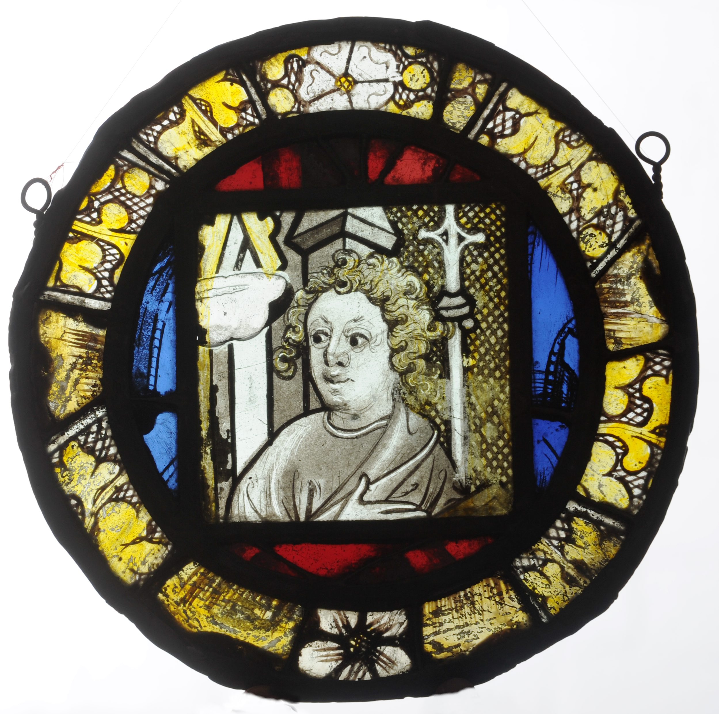 A 14th/15th century stained leaded glass panel Of circular form centred with a portrait panel of a