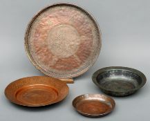 A tinned copper bowl, with Evertei rim, possibly 17th century And three other circular dishes,