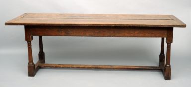 An 18th century and later oak refectory table The cleated rectangular top above the carved frieze,