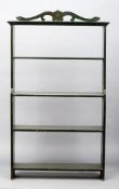A green painted pine bookcase The carved and pierced pediment above four fixed shelves. 106 cms