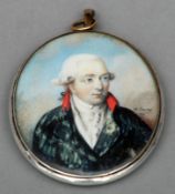 An English 18th century portrait miniature of a gentleman in a navy blue coat On ivory laid on