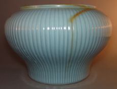 A Chinese porcelain vase The ribbed body with allover duck egg blue glaze with russet striations,