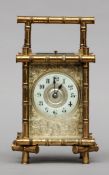 A 19th century brass cased repeating carriage clock The dial with Arabic numerals within a scroll