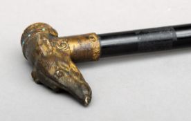 A Victorian bronze dog’s head handle walking stick The handle formed as greyhound with inset ruby