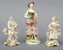 An 18th century Derby figurine Modelled as a young lady wearing a hat and holding a flower; together
