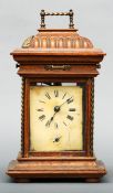 A walnut cased polyphone style musical mantel clock The movement with Arabic numerals above a