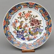 A 19th century polychrome Delft charger Decorated in the chinoiserie style with cockerels in a