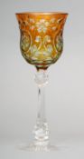 A Stevens & Williams of Stourbridge intaglio cut cameo wine glass Amber overlaid, supported on a
