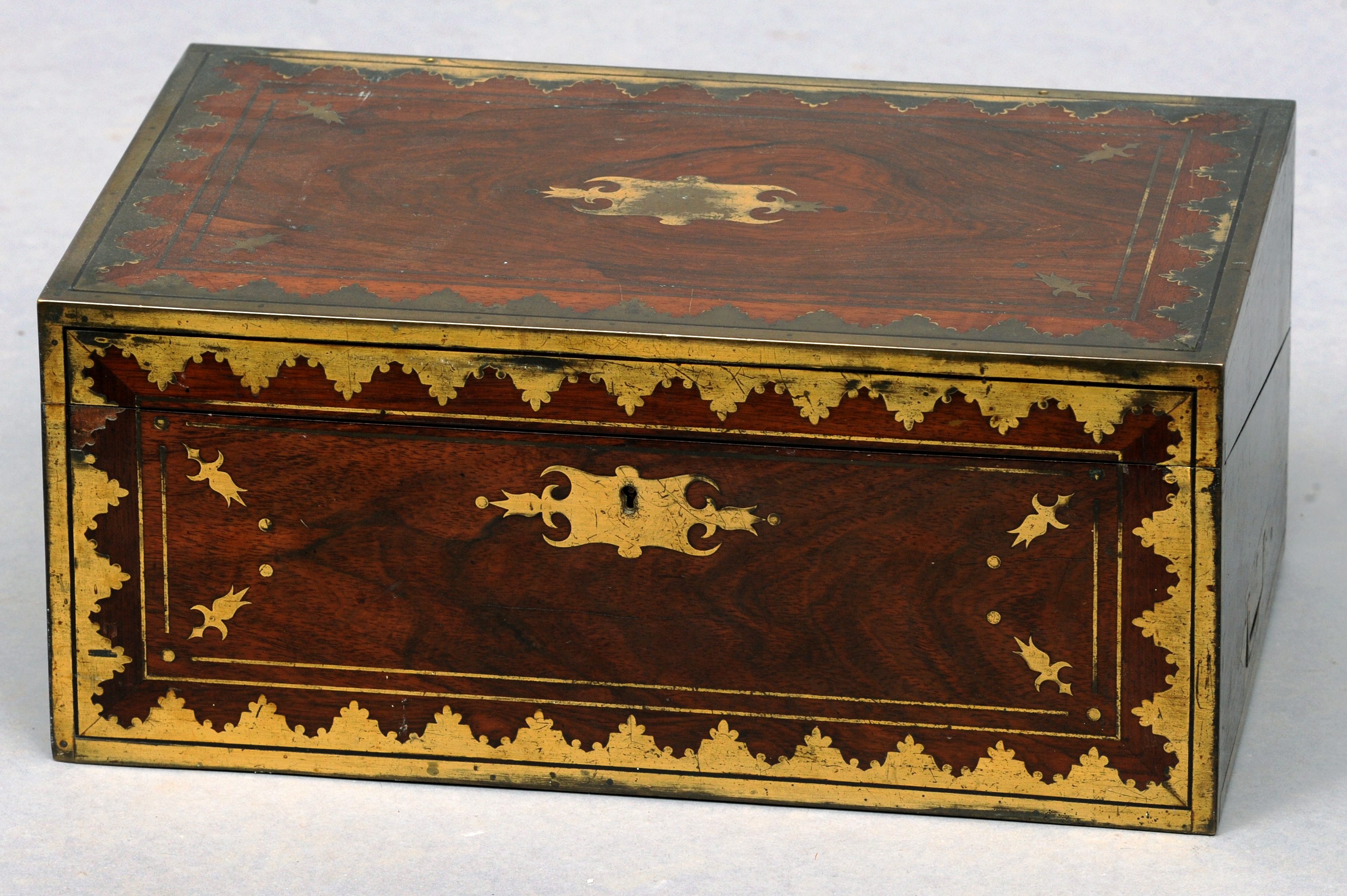 An early 19th century brass mounted rosewood travelling secretaire The hinged rectangular top