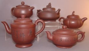 Five Chinese Yixing pottery teapots and covers Variously moulded and decorated, all with impressed