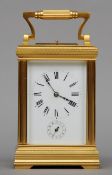 A 19th century Continental quarter chiming repeating carriage alarm clock The white enamelled dial