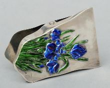 A Chinese silver and enamel letter clip The front with enamel decorated flowers, the reverse with
