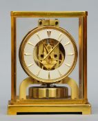 A Jaeger LeCoultre Atmos clock The silvered dial with baton markers, the movement signed LeCoultre