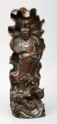 A Chinese carved hardwood figure of Guanyin Holding a ruyi sceptre. 41 cms high.Generally in good