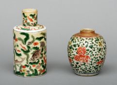 A 19th century Chinese porcelain tea cannister The cylindrical body decorated with fish amongst