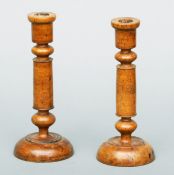 A pair of early 19th century Scandinavian turned burr birch candlesticks Each with knopped stem