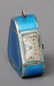 An Art Deco style blue guilloche enamel decorated pendant watch With hinged recess to one side,