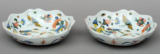 A pair of Continental faience pottery bowls Each with wavy rim and polychrome decorated with birds
