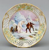 A Dresden porcelain reticulated dish Decorated with and Arctic scene of explorers and their dogs