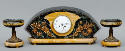 An Art Deco gilt metal and variegated marble triple clock garniture The central timepiece with white