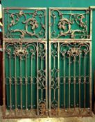 A pair of large 18th century cast and wrought iron gates Each with rococo panels with C-scrolls