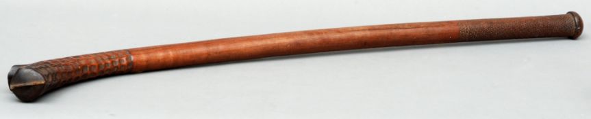 A 19th/early 20th century Fijian gun stock club Of typical form with chip carved decoration. 102 cms