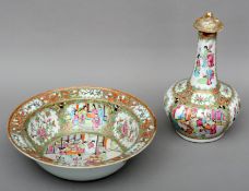 A large 19th century Cantonese porcelain bowl Decorated with figures in interiors and vignettes of