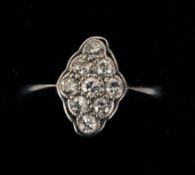 A gold and diamond lozenge set ring